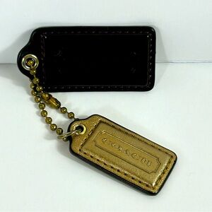 Coach Brown and Gold Metallic Purse Charms, two charms